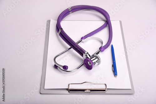 Doctor s Desk with tablet  writing papers and stethoscope