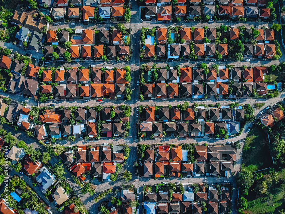 Aerial, bird view of the old european city with red tiled roofs of neighborhood family houses, background Aerial, bird view of the old european city with red tiled roofs of neighborhood family houses, background