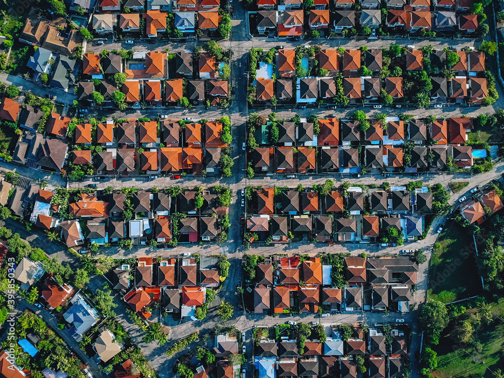 Aerial, bird view of the old european city with red tiled roofs of neighborhood family houses, background