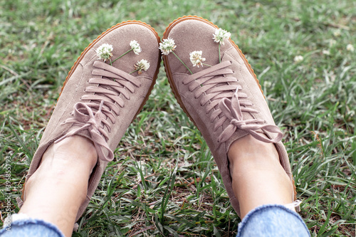 Creeper shoes with flowers in a beautiful nature background. Concept of resting, relaxing and lifestyle.