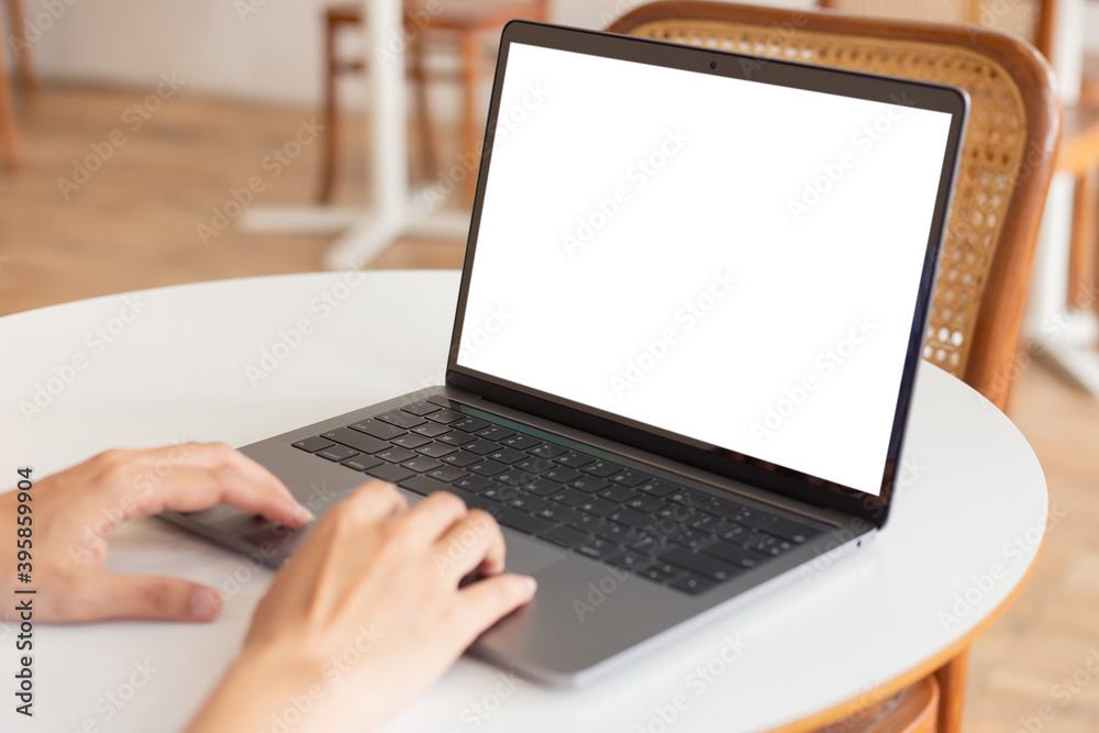 computer blank screen mockup.hand woman work using laptop with white background for advertising,contact business search information on desk at coffee shop.marketing and creative design computer blank screen mockup.hand woman work using laptop with white background for advertising,contact business search information on desk at coffee shop.marketing and creative design