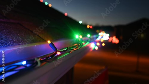 4k Time lapse of Christmas lights on a house gutter turning on at dusk