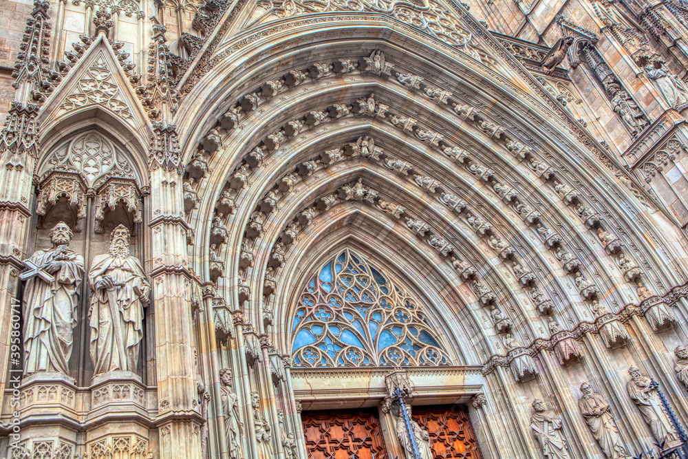Doorway details of Cathedral of Barcelona . Entrance of Imposing Gothic cathedral in Catalunya