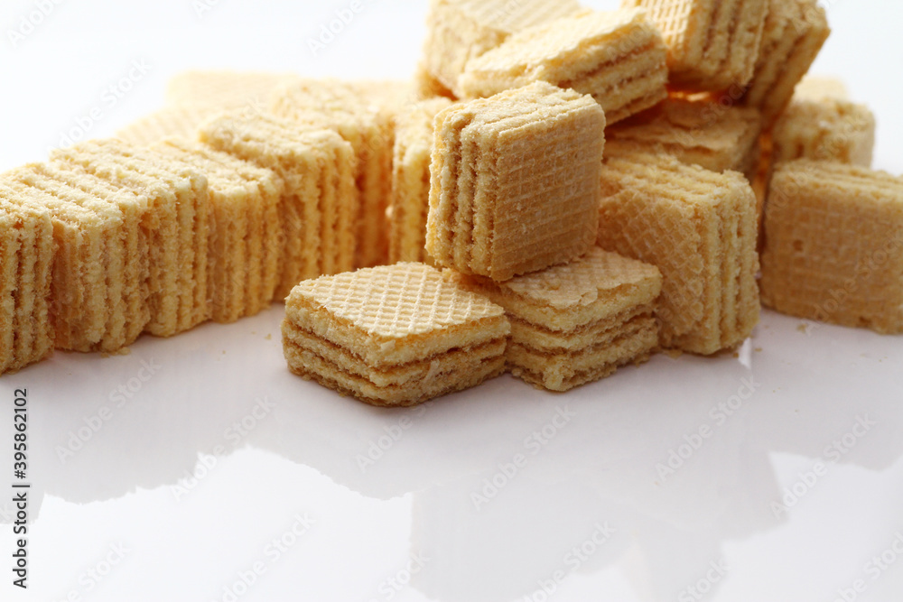 Lemon cream cube wafer on white background