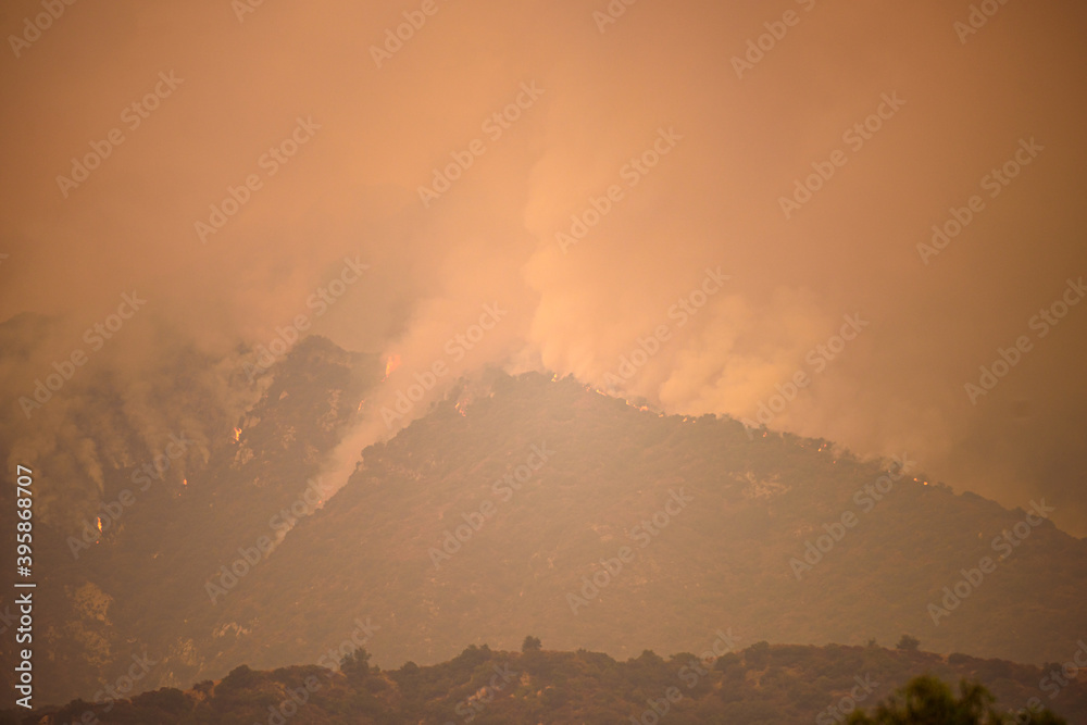 Fire and smoke in the mountains of California. Forest fires. Air