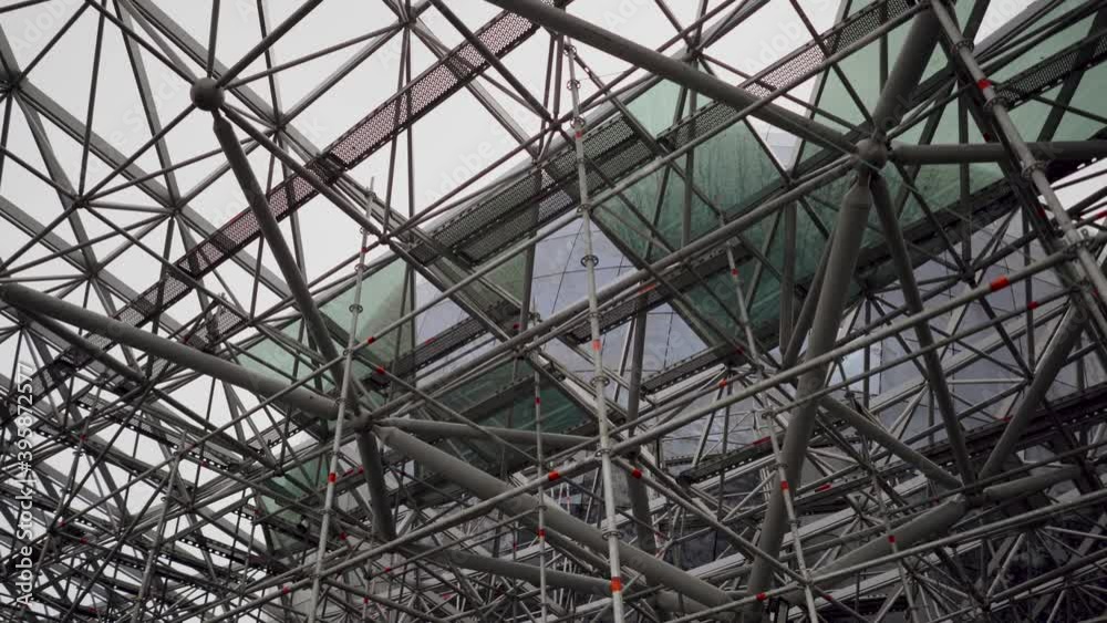 Modern storehouse construction site metal structures of beams, structural steel structure of new commercial building. Construction of modern factory