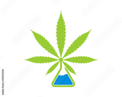 Cannabis leaf with laboratory test tube