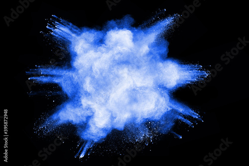 Blue powder explosion isolated on black  background.
