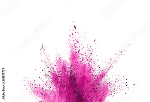 Freeze motion of purple color powder exploding on white background. 