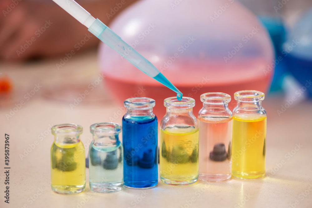Young male chemist working in the lab Young male chemist working in the lab