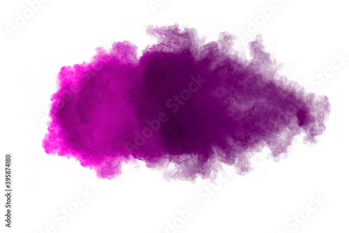 Freeze motion of purple color powder exploding on white background. 