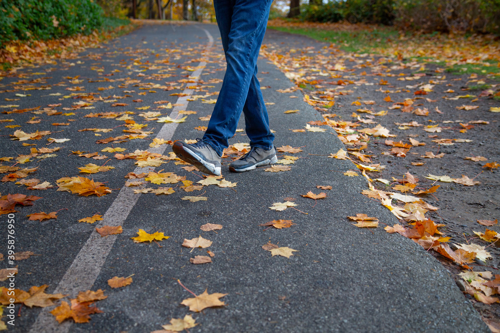 a man walking on the street in fall image 