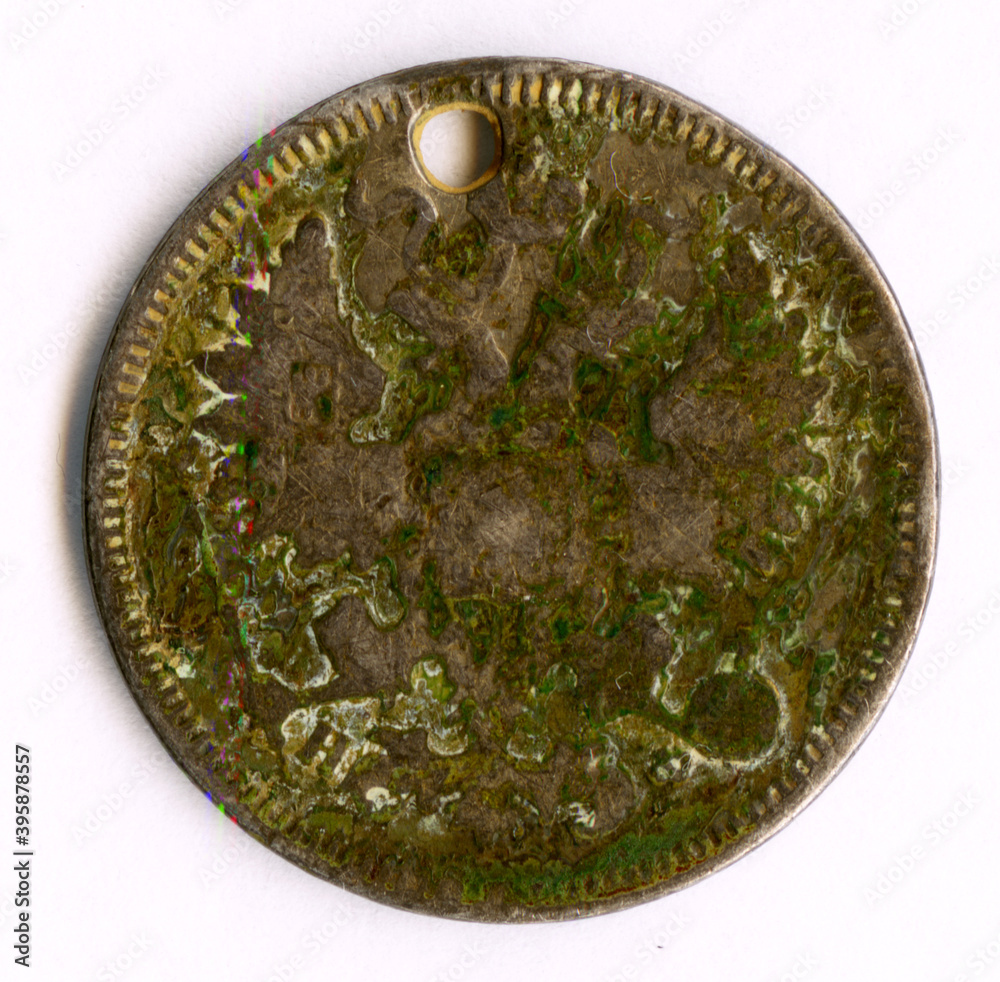 Old Russian coin 20 kopecks, 1866 issue.Used by Bashkir women as a decoration, strung through a hole.