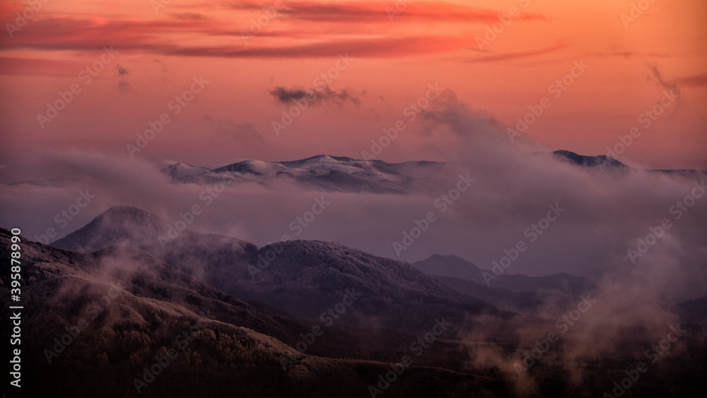 Obraz premium A beautiful mountain scenery. Pikui mountain range (Ukraine) seen from the Bieszczady National Park (Poland). The Carpathian Mountains.