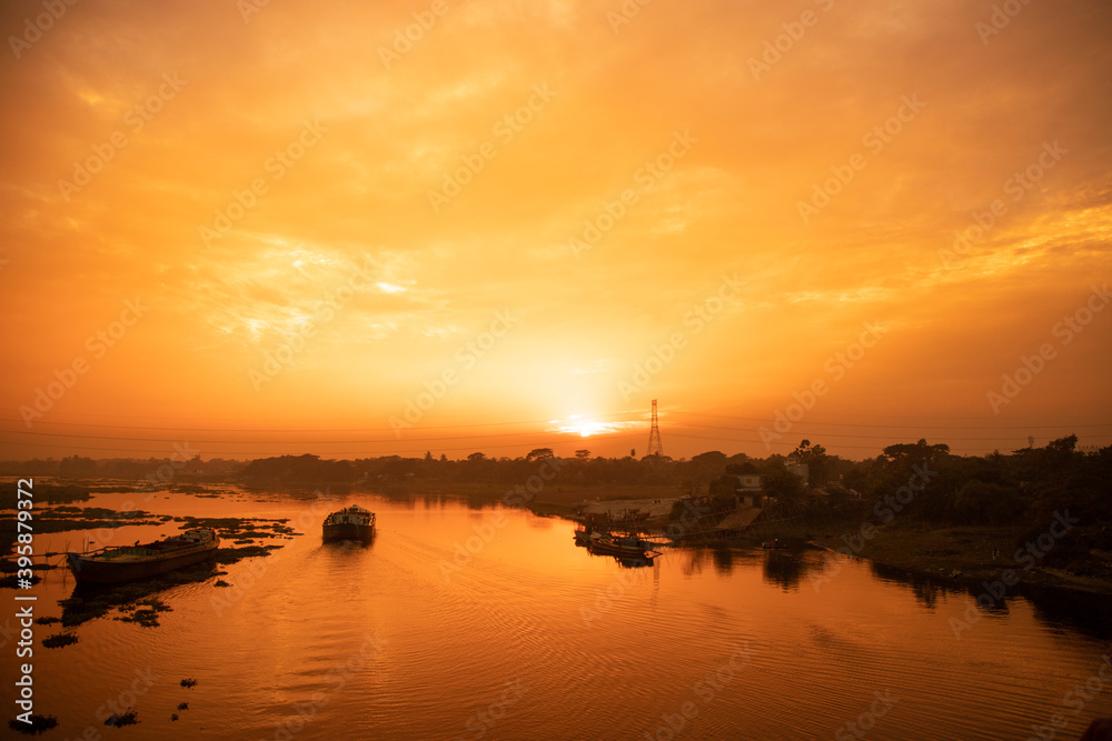 Panoramic view of the boat at sunset with river