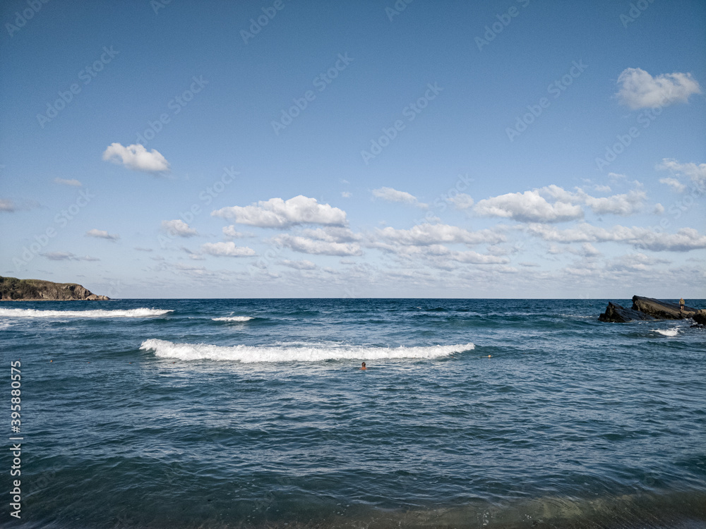 Coast of sea with clouds and sand of beach Coast of sea with clouds and sand of beach