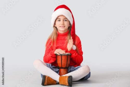 Cute little girl in Santa h...