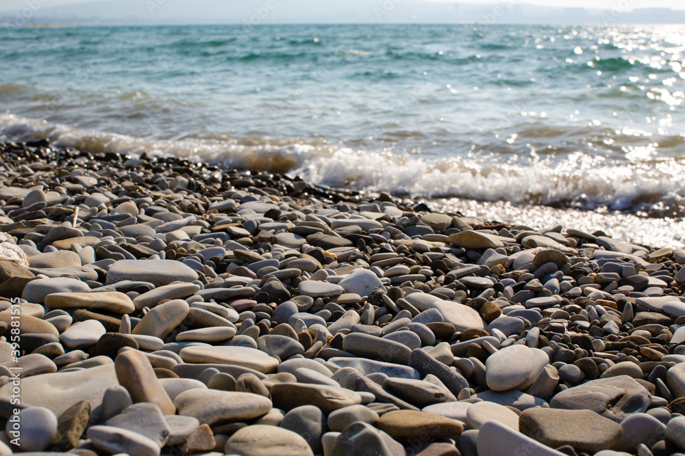 Pebble beach against the sea wave Pebble beach against the sea wave