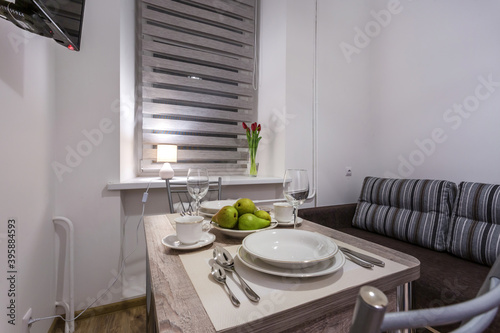 served table in interior of modern luxure guest room in studio apartments in minimalistic style