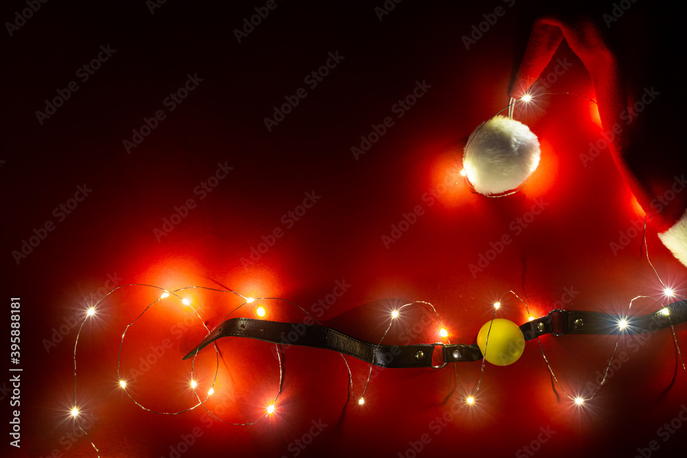New year banner with christmas balls, santa hat and yellow gag with black leather collar