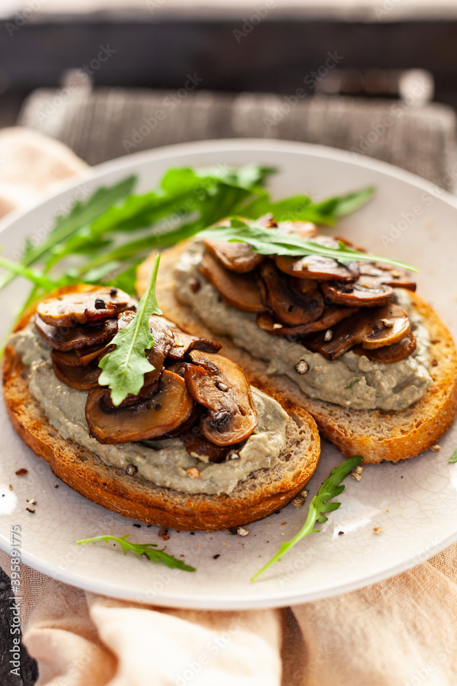 bread with mushrooms and curd cheese, arugula