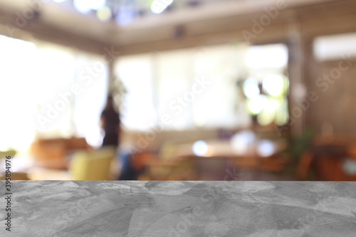 Cement floor for place products and blurred coffee shop background.