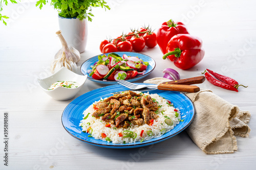 gyros with rice and green salad and zaziki photo