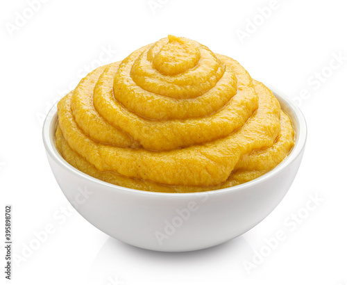Mustard in bowl isolated on white background