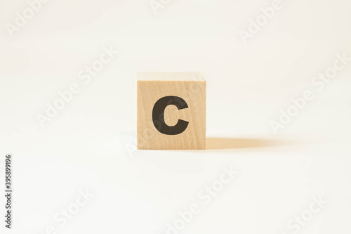 English letter C on a cube on a white background.