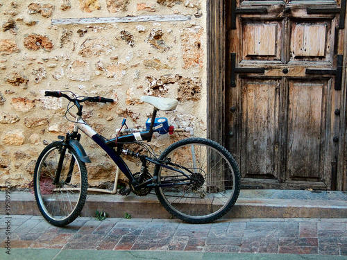 Ancient door and modern bicycle