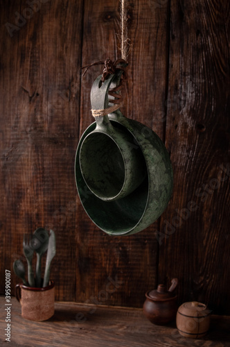 Cookware rural style. Dark wooden background. photo