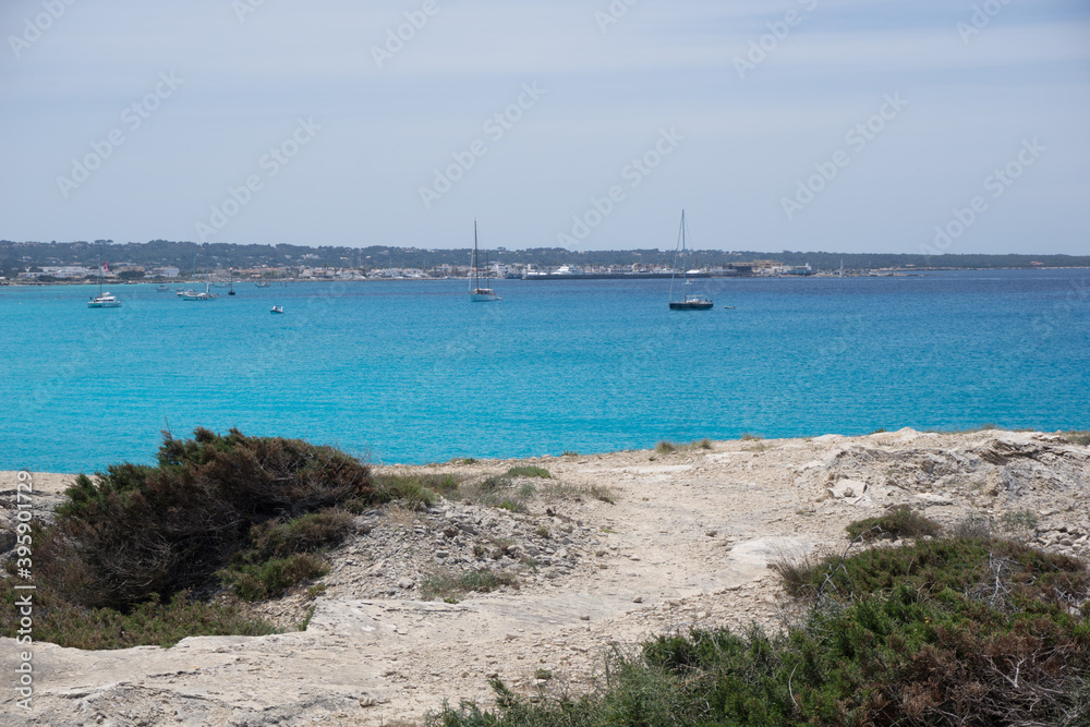 a bay with brilliant blue water from formentera a small island near ibiza
