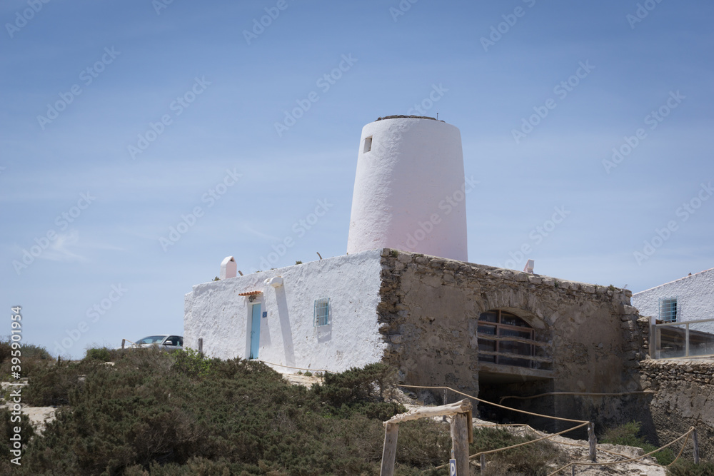 a building on the island of formentera in summer when the weather is good
