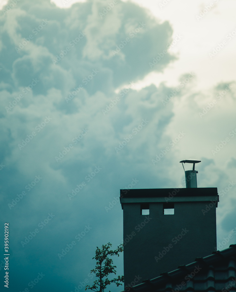 brick chimney on a background of clouds brick chimney on a background of clouds