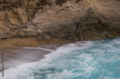 Fototapeta Naklejka Na Ścianę i Meble -  Waves breaking at the beach of Nas in a quiet evening in Ikaria