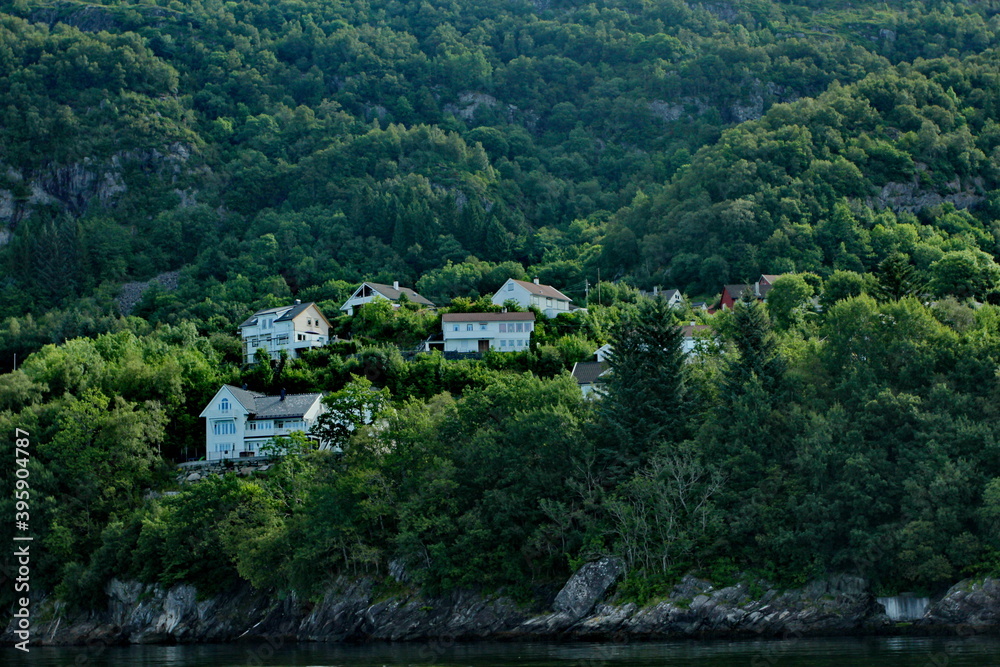 Scenic view of cottages in the woods on the shores of Osterfjord near Bergen, Norway