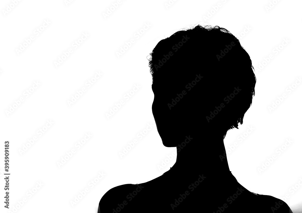 Female person silhouette in the shadow, back lit light