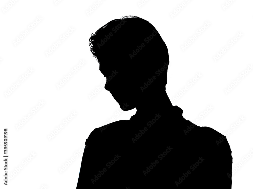 Female person silhouette in the shadow, back lit light