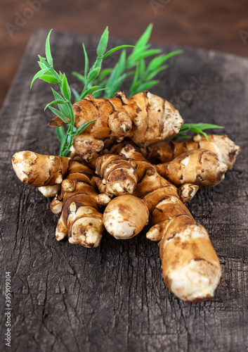 Obraz na plátne jerusalem artichoke on brown background. Topinambur isolat
