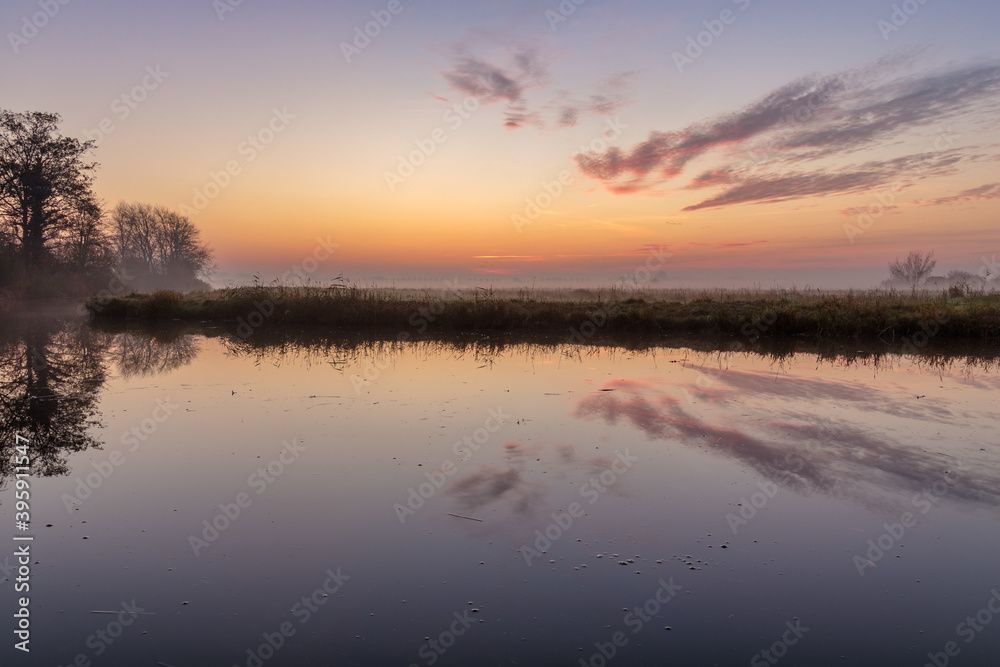 Colorful sunrise in Dutch polder landscape