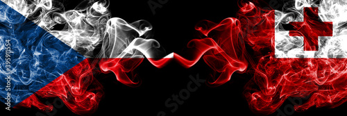 Czech Republic  Czech vs Tonga smoky mystic flags placed side by side. Thick colored silky abstract smoke flags.
