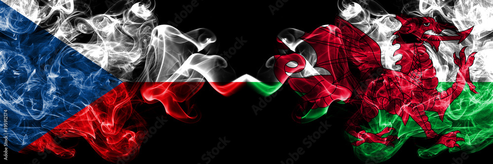 Obraz premium Czech Republic, Czech vs Wales, United Kingdom smoky mystic flags placed side by side. Thick colored silky abstract smoke flags.