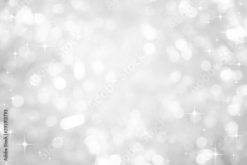 abstract blur white and silver color background with star glittering light for show,promote and advertisee product and content in merry christmas and happy new year season collection concept