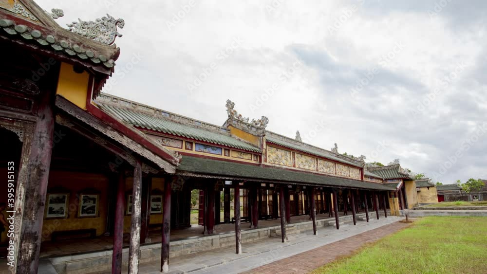 Time lapse of Walled fortress entrance to Hue Imperial City, Vietnam. Symmetrical frontal view with cobble stone ground and cloudy blue sky Time lapse of Walled fortress entrance to Hue Imperial City, Vietnam. Symmetrical frontal view with cobble stone ground and cloudy blue sky