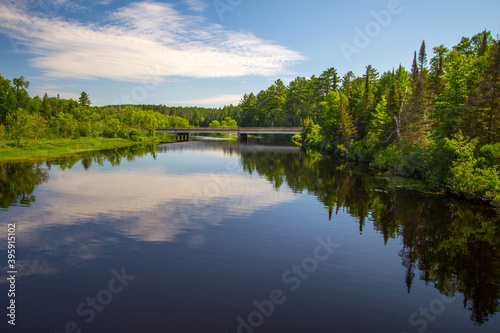 The Au Sable River. The Au Sable River flows through a lush remote wilderness forest in northern Michigan.