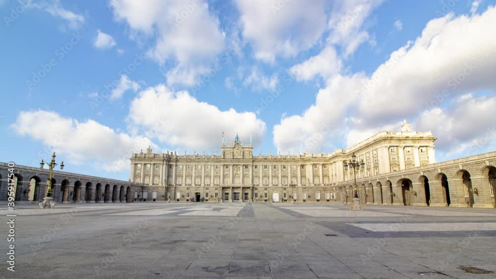 Time lapse royal palace of Madrid, Spain during a sunny cloudy day. Close up of baroque build with blue sky and clouds in background. There aren't tourists because of pandemic moment of coronavirus 