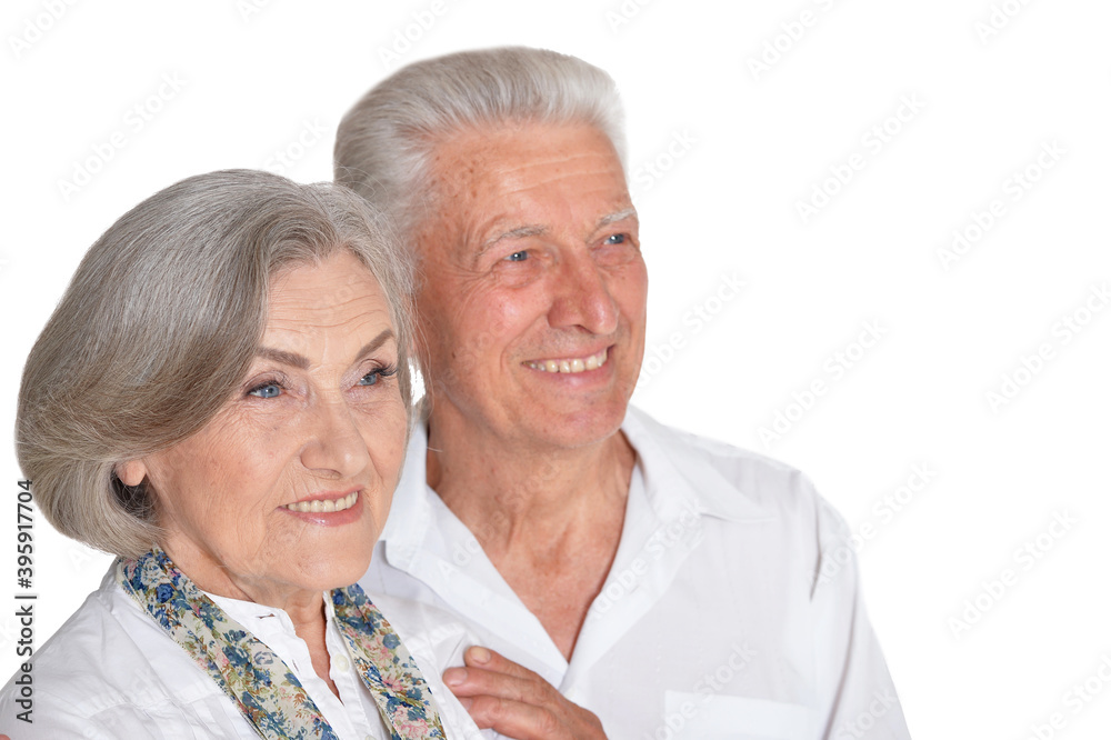 Happy beautiful senior couple huging and posing isolated Happy beautiful senior couple huging and posing isolated