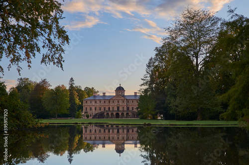 Rastatt Favorite Palace (Schloss Favorit) and idyllic palace garden with pond at sunset in Foerch, Germany, Europe
