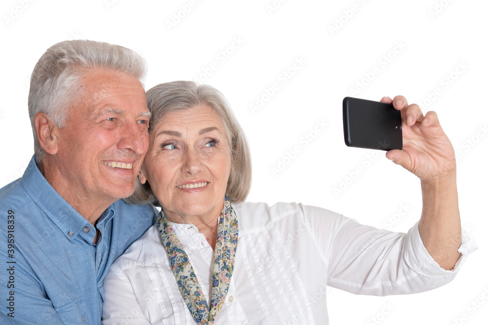 Close-up portrait of senior couple taking selfie Close-up portrait of senior couple taking selfie