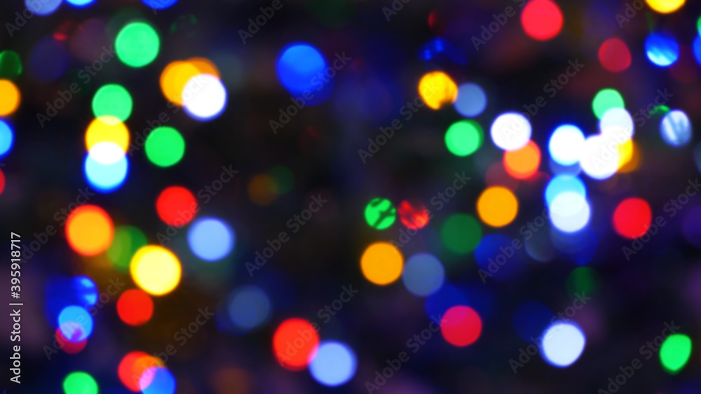 Blurred fairy lights. Out of focus holiday background christmas tree.